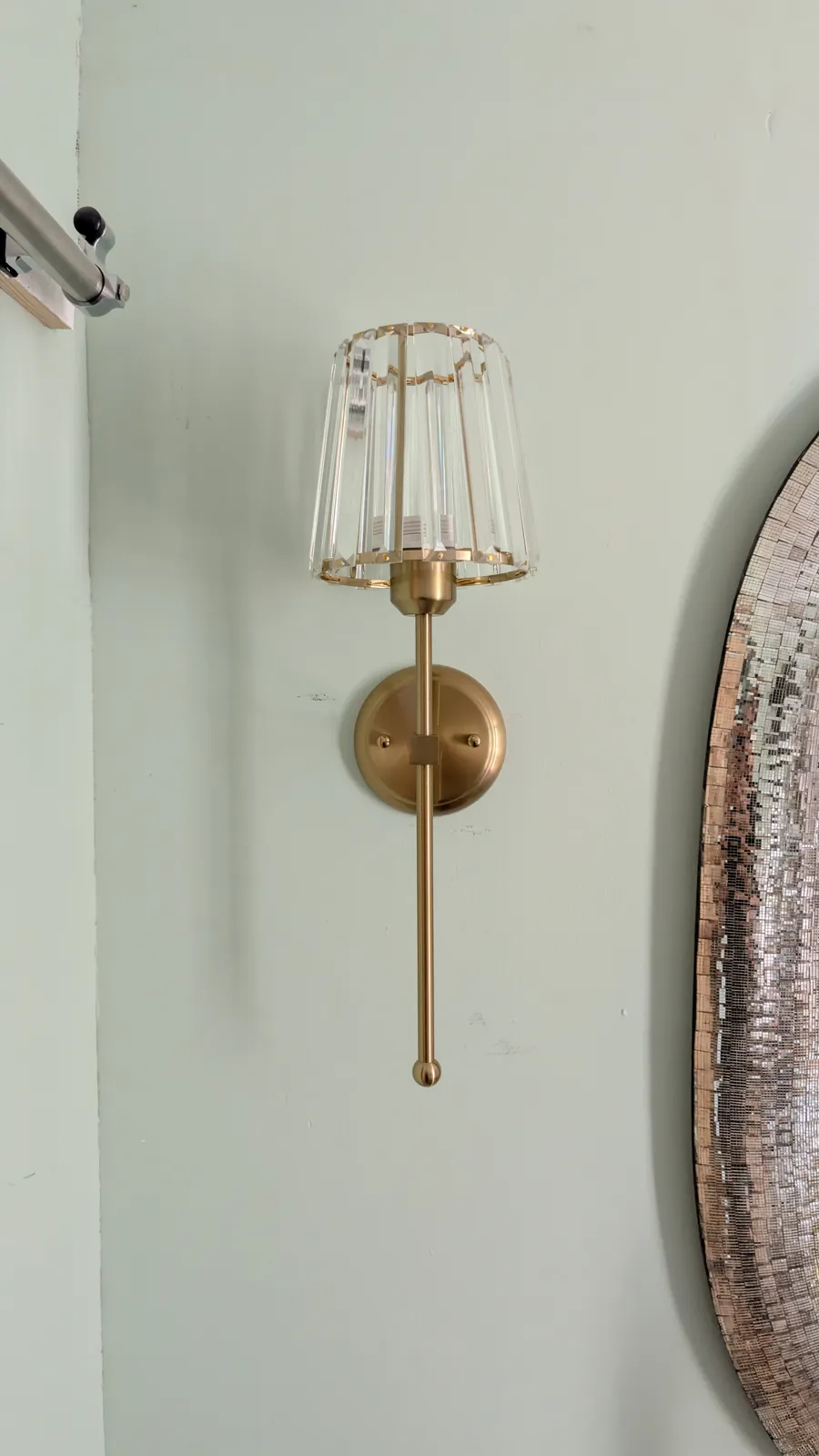 Brass wall sconce with glass shade fitted