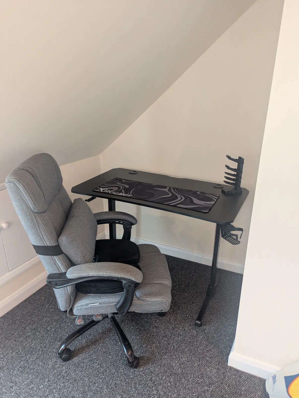 Gaming desk and chair assembled in a loft room